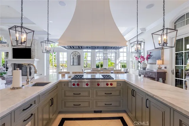 a bathroom with a granite countertop sink a mirror and shower