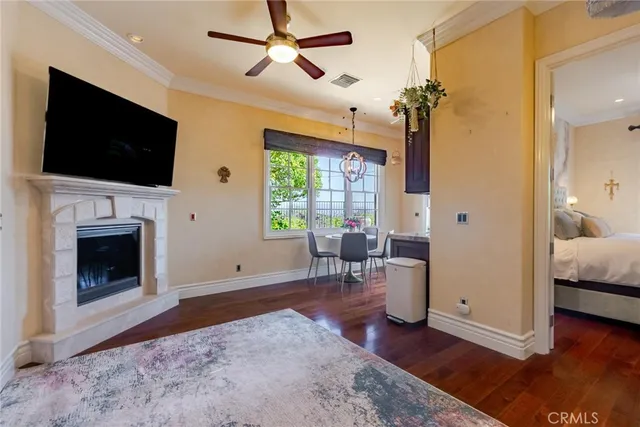 a living room with furniture chandelier and a window