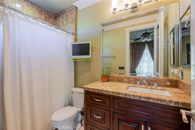 a kitchen view with wooden floor and a refrigerator