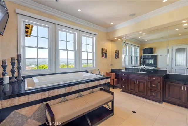 a room with pool table and windows