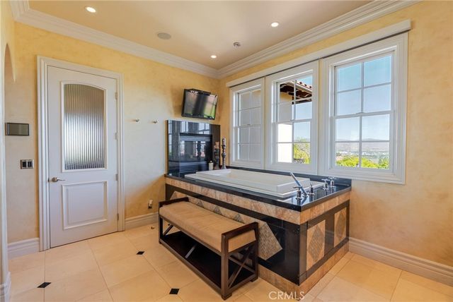 a kitchen with granite countertop a stove and a wooden cabinets
