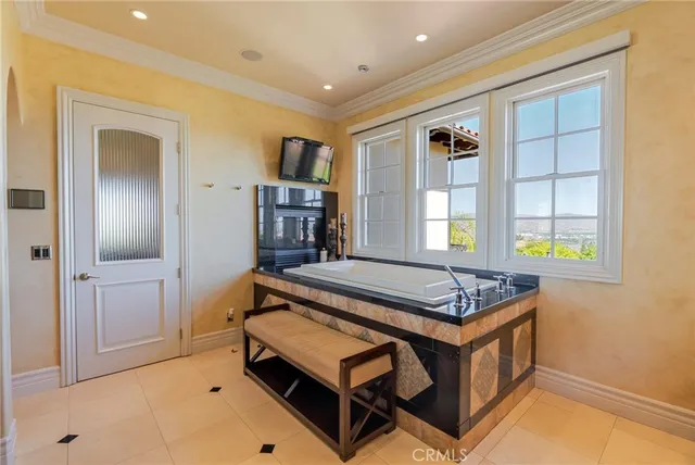 a kitchen with granite countertop a stove and a wooden cabinets
