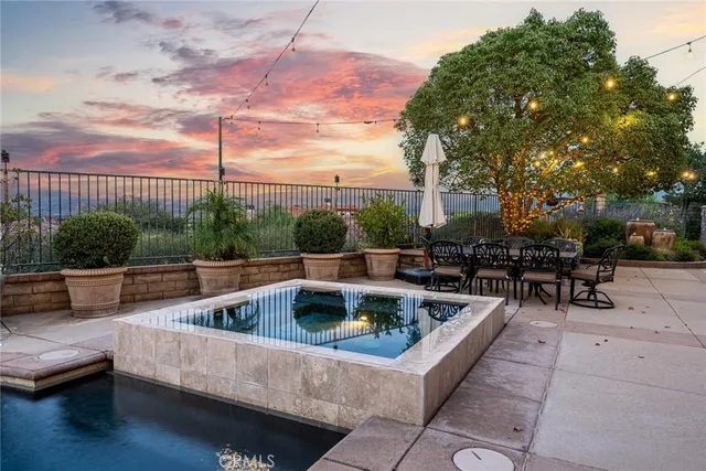 a view of a swimming pool with a patio