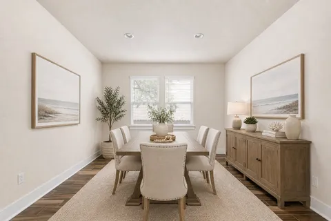 a dining room with furniture and window