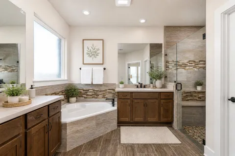 a bathroom with a granite countertop sink mirror and a bathtub