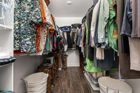 a bathroom with a toilet a sink and a shower curtain