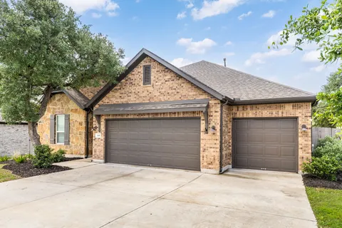 a front view of a house with a garage