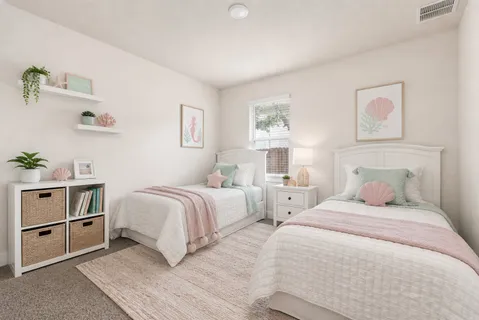 a bedroom with two beds and painting on the wall