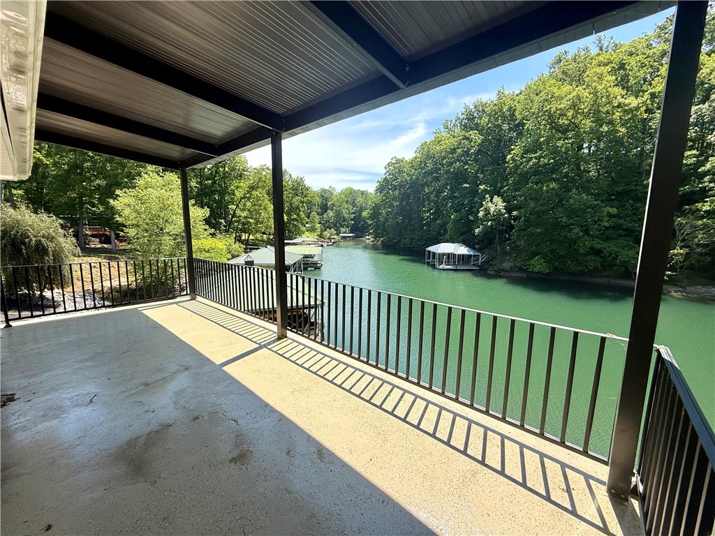 1200 Loran Pointe Circle Seneca, SC 29672 - Photo 27 of 29 Enjoy tranquil water views from this expansive deck, perfect for peaceful mornings and relaxing evenings.