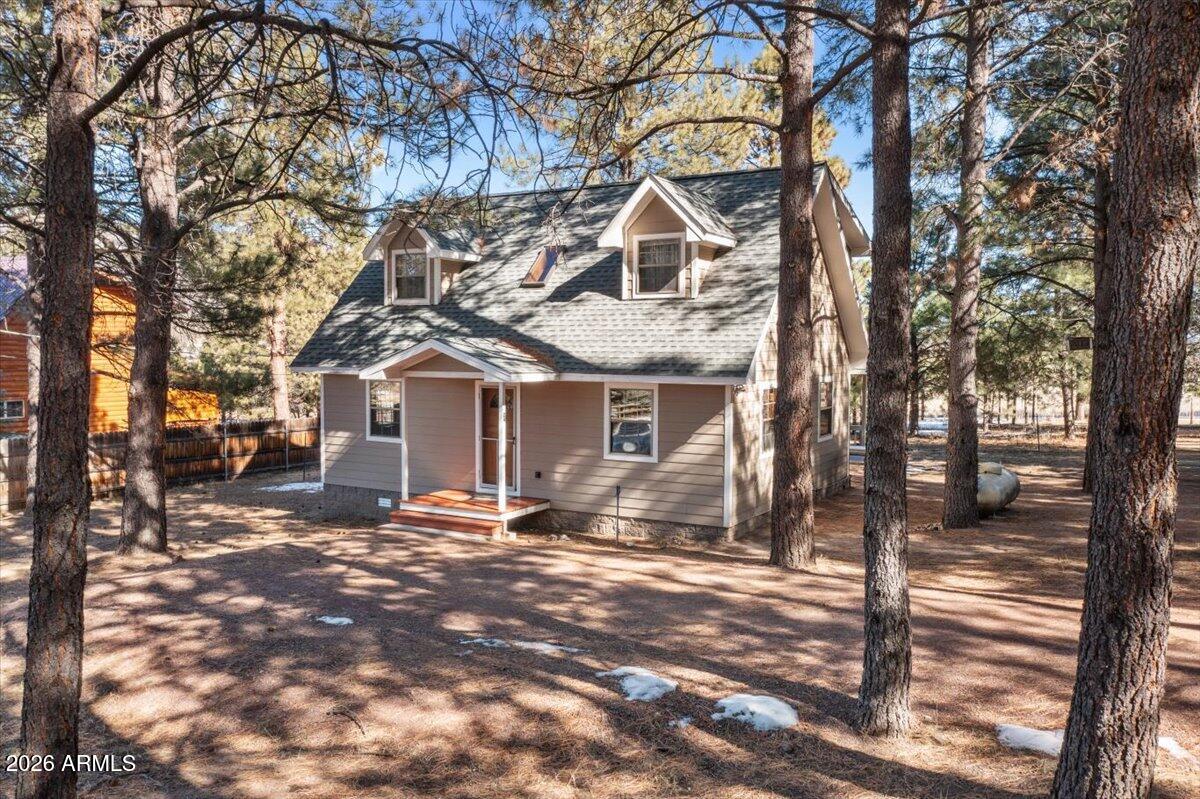 24 County Road 2065 Alpine, AZ 85920 - Photo 24 of 32 a view of a house with a yard covered in snow