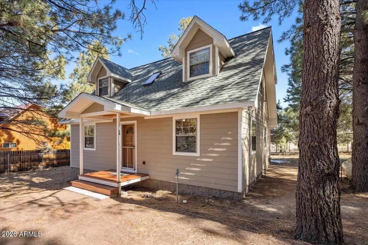 24 County Road 2065 Alpine, AZ 85920 - Photo 5 of 32 a view of a house with a tree and wooden fence