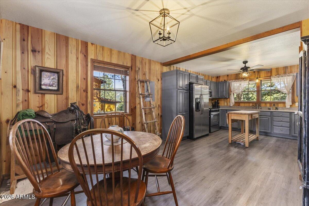 24 County Road 2065 Alpine, AZ 85920 - Photo 6 of 32 a view of a dining room with furniture window and wooden floor