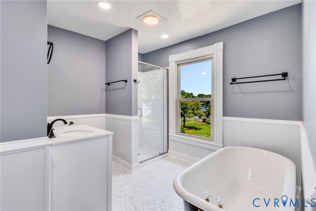 618 Main Street Reedville, VA 22539 - Photo 35 of 54 Bathroom featuring a clawfoot tub, a glass-enclose