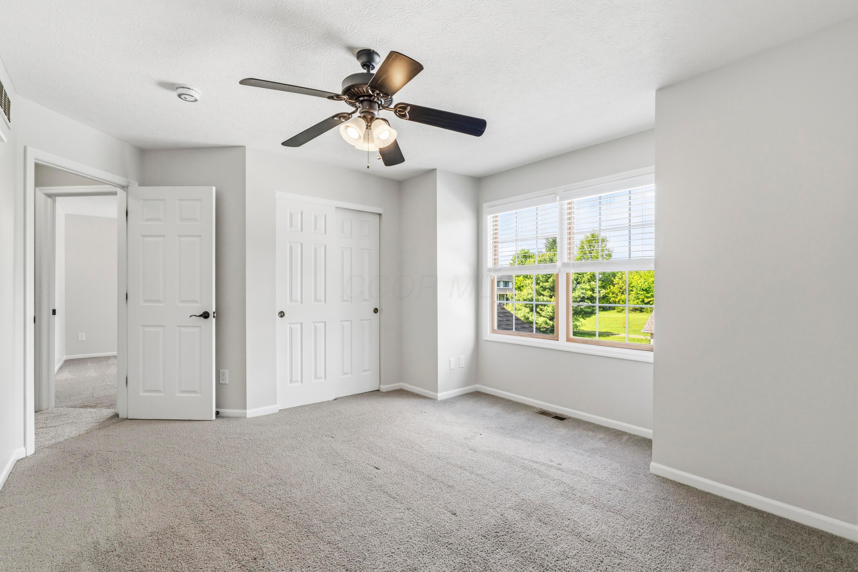 8507 Benner Road Johnstown, OH 43031 - Photo 40 of 69 Large Bedroom #3 with ceiling fan and NEW Carpet!