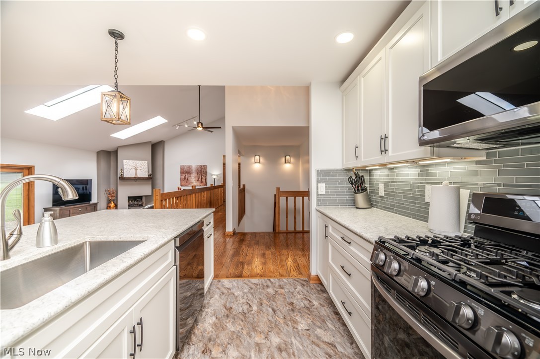 405 Airport Road Northwest Warren, OH 44481 - Photo 15 of 50 Kitchen featuring white cabinetry, light-toned countertops