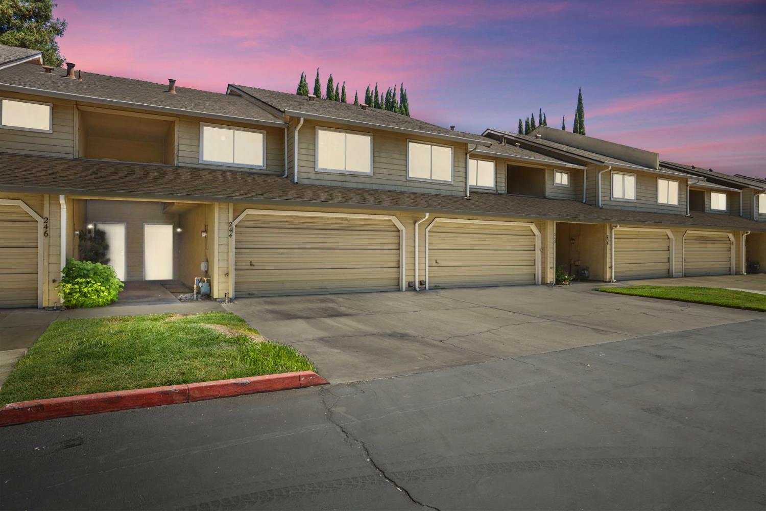 244 Tiffany Circle Ripon, CA 95366 - Photo 1 of 1 a front view of a house with a yard and garage