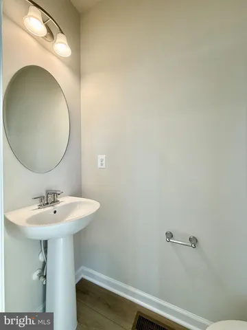 a bathroom with a sink and mirror