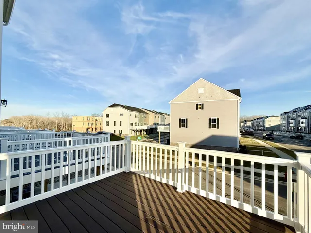 a view of a house with wooden fence
