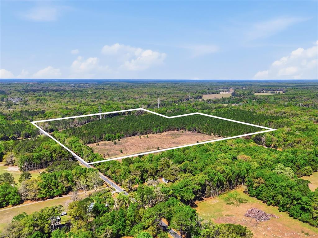 11791 Southwest 143rd Street Archer, FL 32618 - Photo 2 of 12 a view of a tennis court
