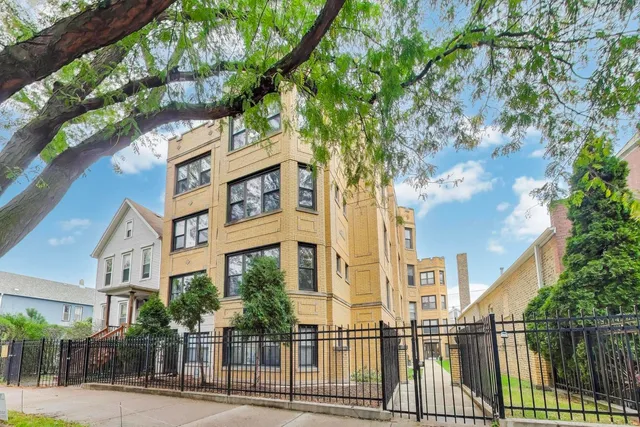 a view of a building with a tree