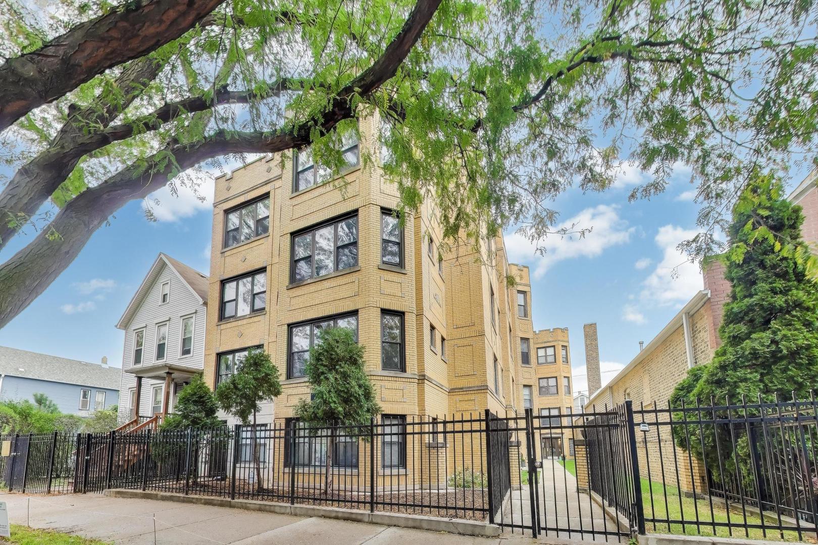 1655 North Fairfield Avenue, Unit 102 Chicago, IL 60647 - Photo 1 of 17 a view of a building with a tree