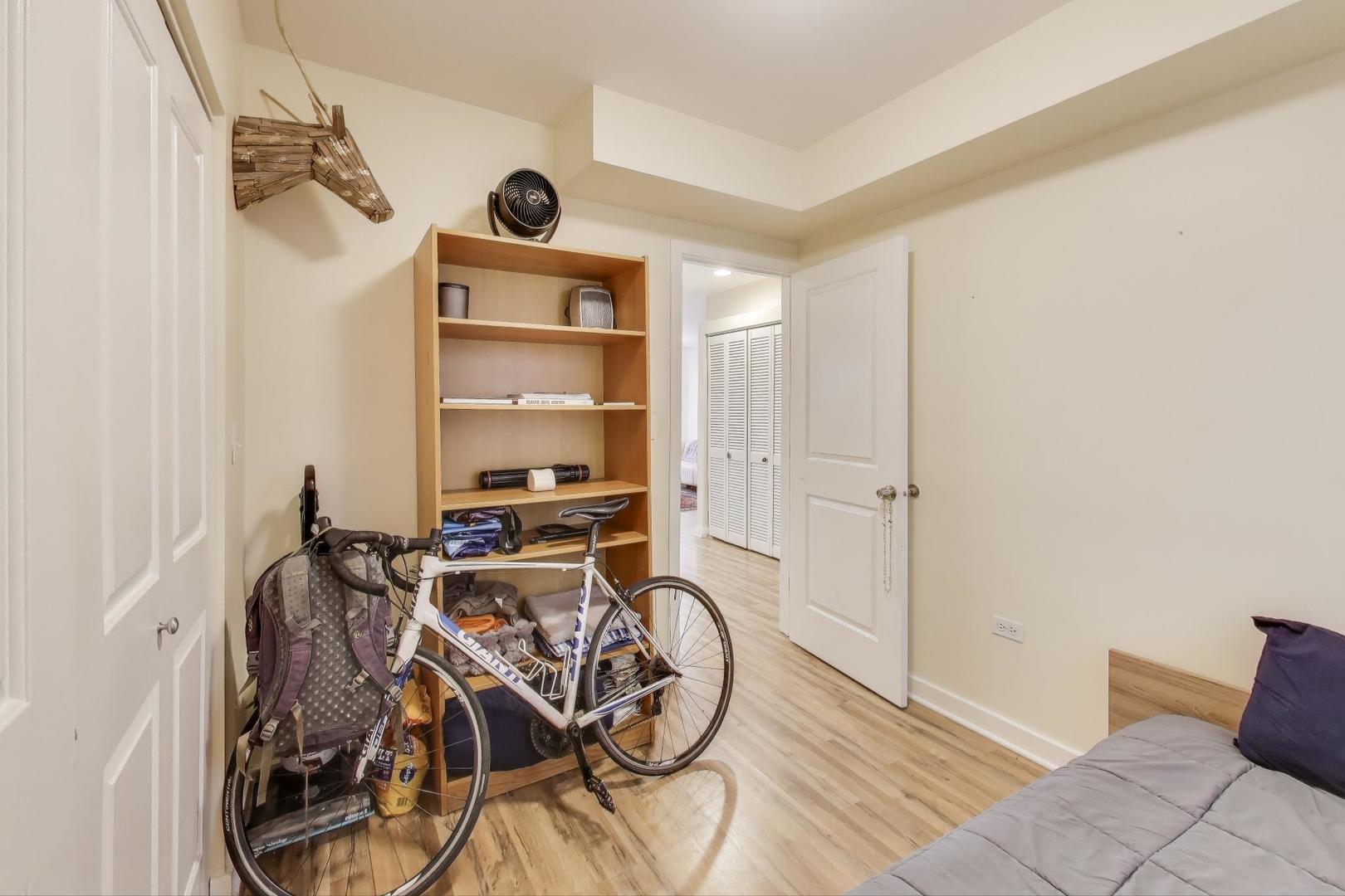 1655 North Fairfield Avenue, Unit 102 Chicago, IL 60647 - Photo 14 of 17 a view of a room with gym equipment