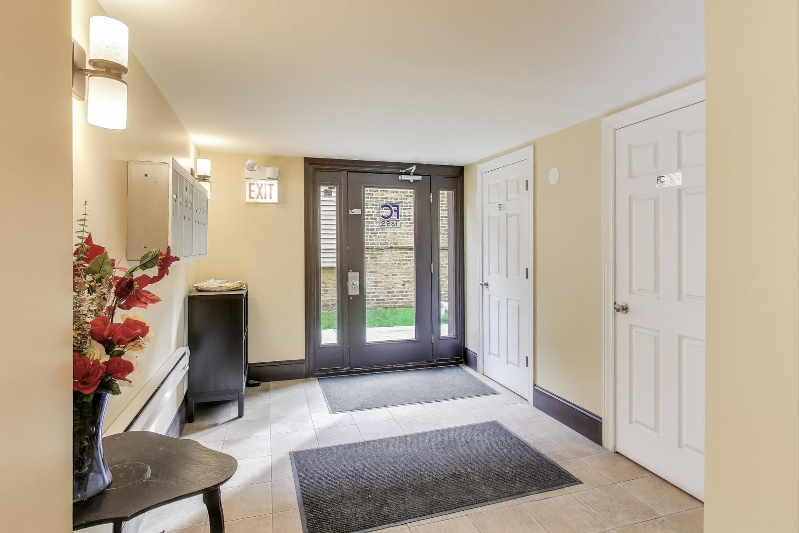1655 North Fairfield Avenue, Unit 102 Chicago, IL 60647 - Photo 3 of 17 a view of livingroom with furniture and a window