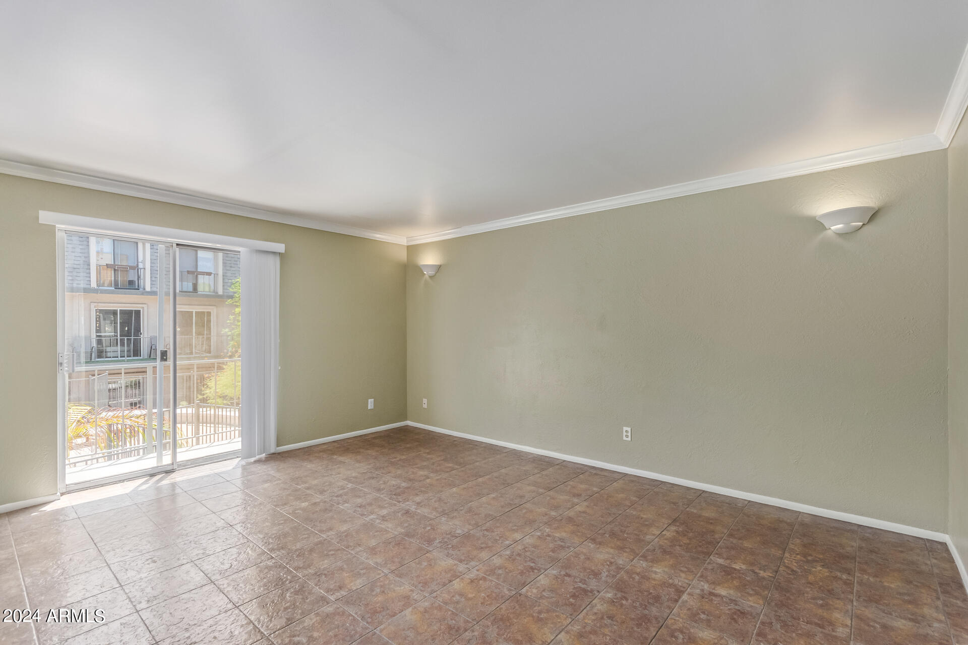 1014 East Osborn Road, Unit C Phoenix, AZ 85014 - Photo 6 of 24 a view of an empty room with a window