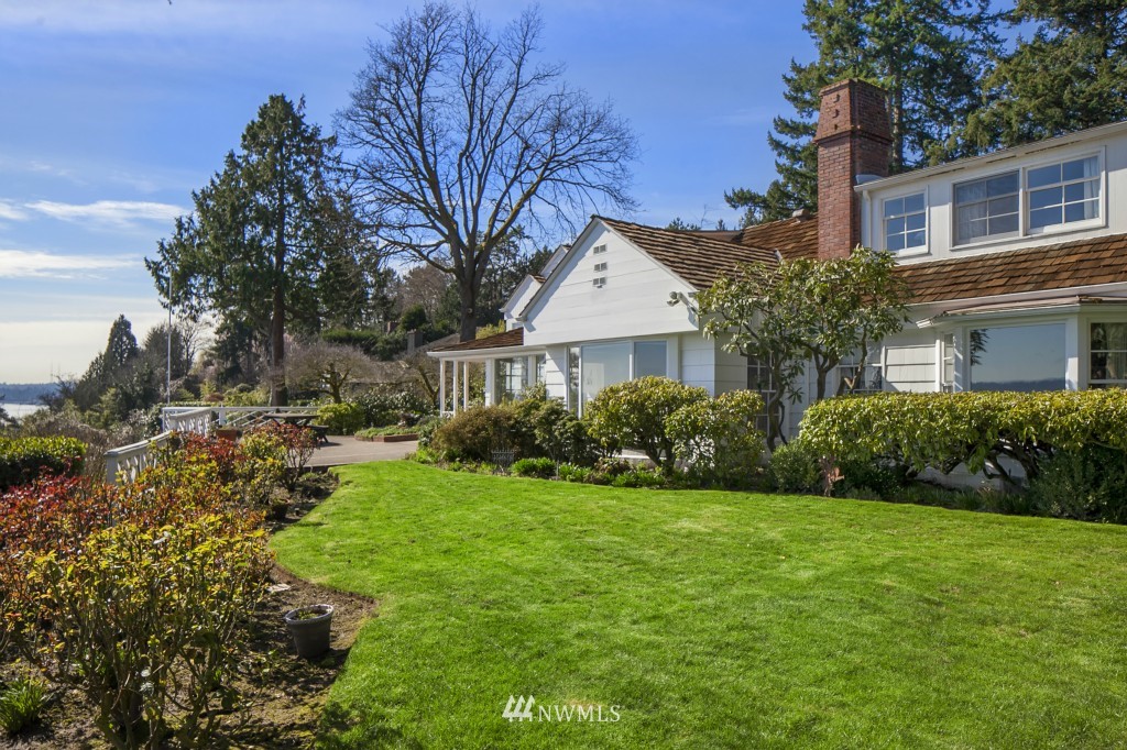 6539 Northeast Windermere Road Seattle, WA 98105 - Photo 4 of 15 a front view of a house with a yard and trees