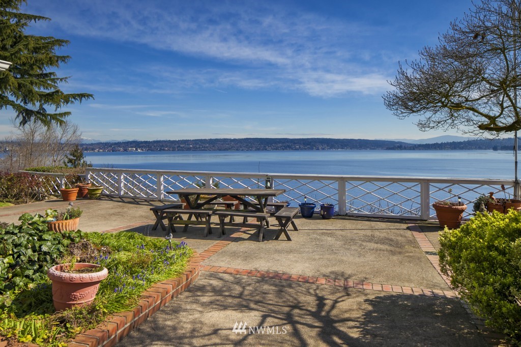 6539 Northeast Windermere Road Seattle, WA 98105 - Photo 6 of 15 a view of a chair and table in back yard of a building