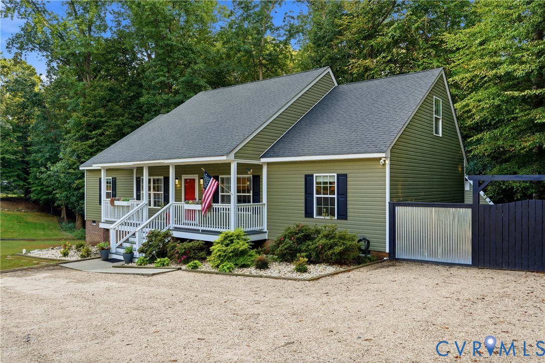 1755 Dispatch Road Quinton, VA 23141 - Photo 4 of 35 Green siding exterior with a dark shingle roof