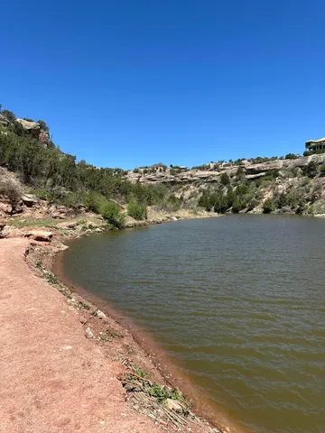 a view of a large body of water with a mountain in the background