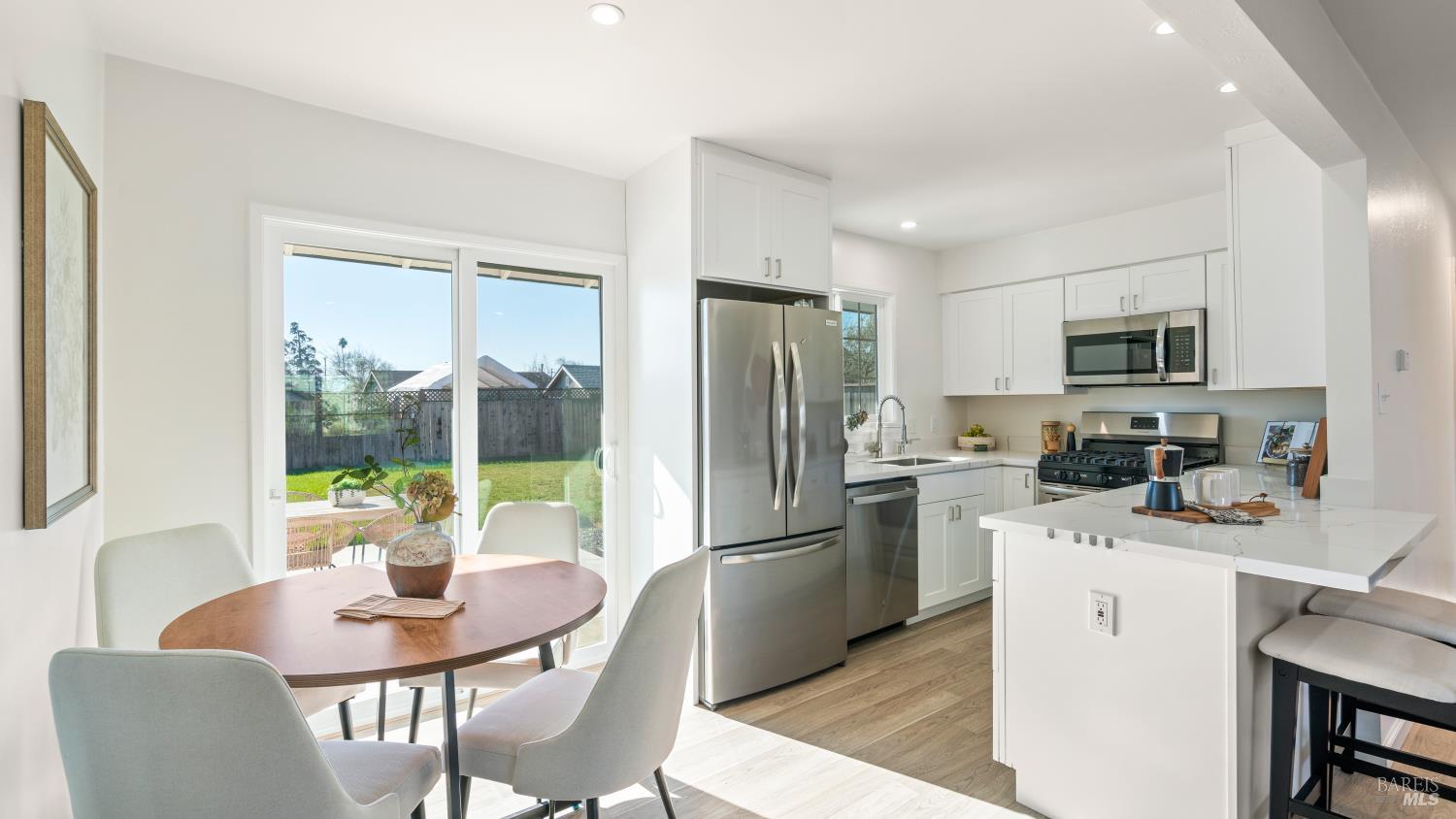 21 Alta Drive Petaluma, CA 94954 - Photo 8 of 22 a kitchen with refrigerator cabinets and dining table