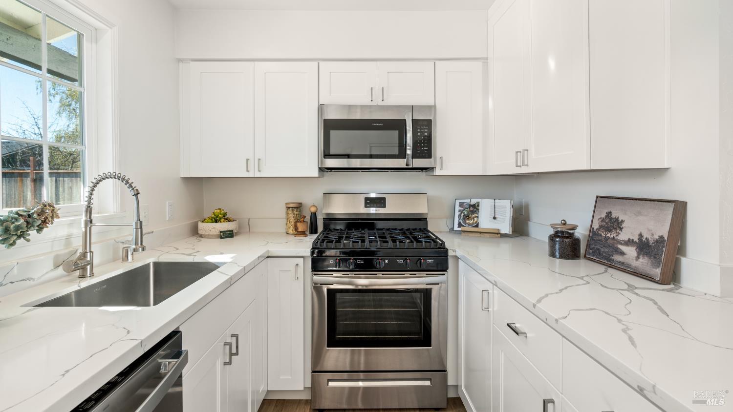 21 Alta Drive Petaluma, CA 94954 - Photo 9 of 22 a kitchen with stainless steel appliances granite countertop a sink stove and microwave
