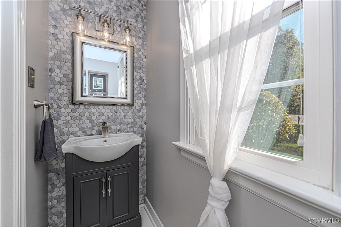 13318 Lady Ashley Road Midlothian, VA 23114 - Photo 20 of 37 1st level half bathroom with mosaic tile finishes