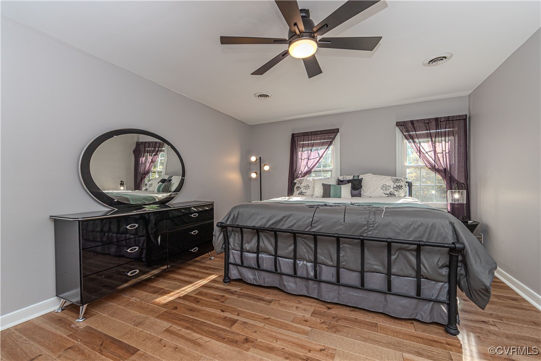 13318 Lady Ashley Road Midlothian, VA 23114 - Photo 21 of 37 Primary bedroom with hardwood floor and ceiling fa