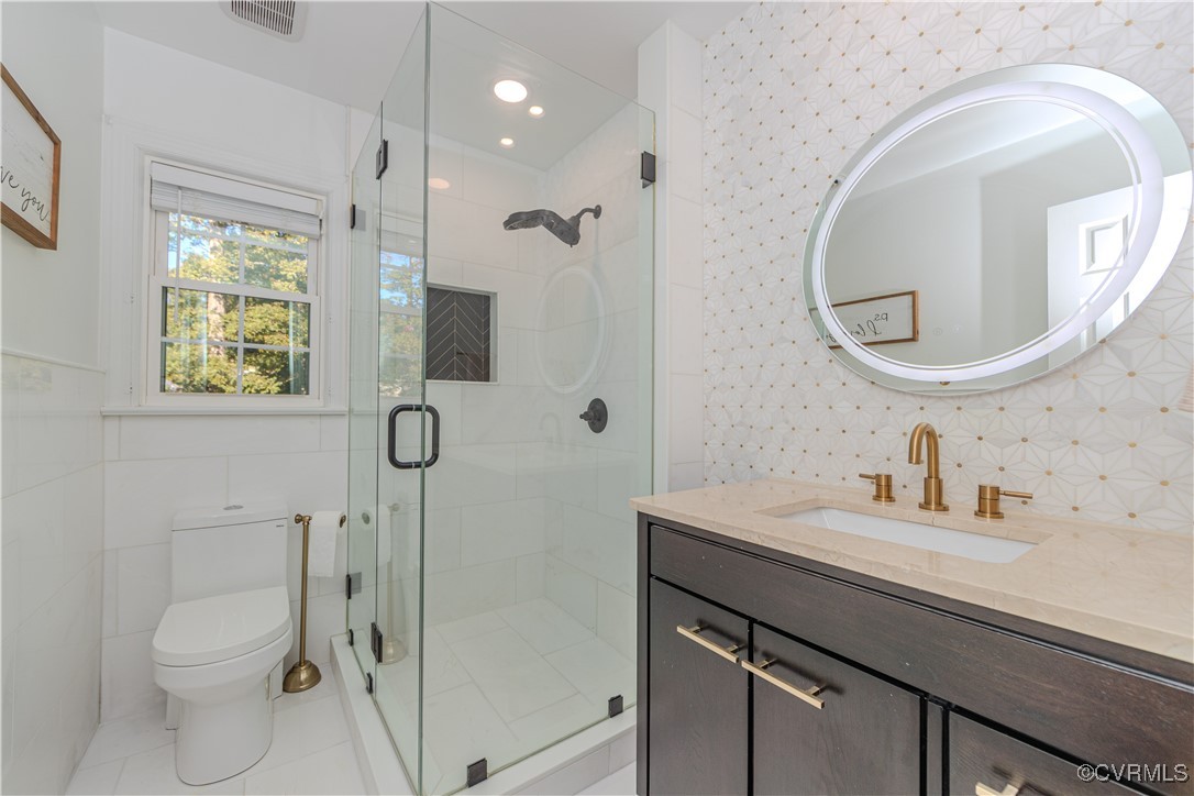 13318 Lady Ashley Road Midlothian, VA 23114 - Photo 23 of 37 Bathroom with frameless shower, beautiful tile fin