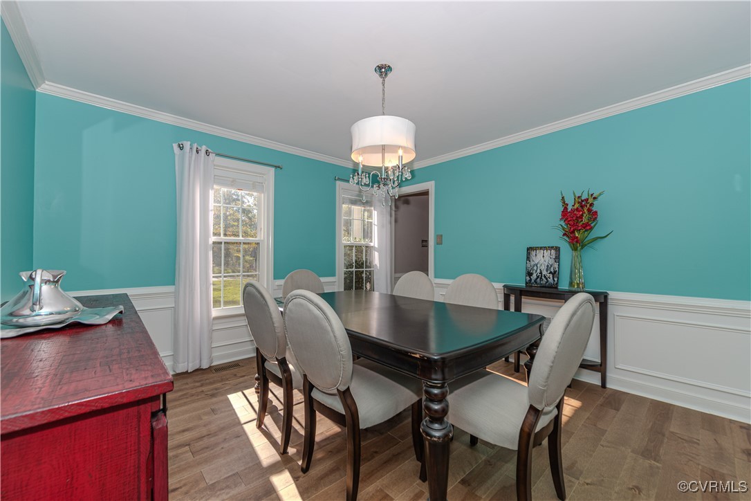Dining space with a crystal-like chandelier, ornam