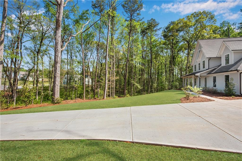 1 Ewing Way Dacula, GA 30019 - Photo 3 of 50 a view of a house with a yard and basketball court