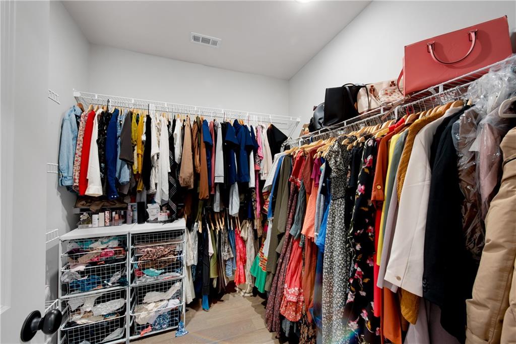1 Ewing Way Dacula, GA 30019 - Photo 34 of 50 a view of walk in closet with clothes and shoes