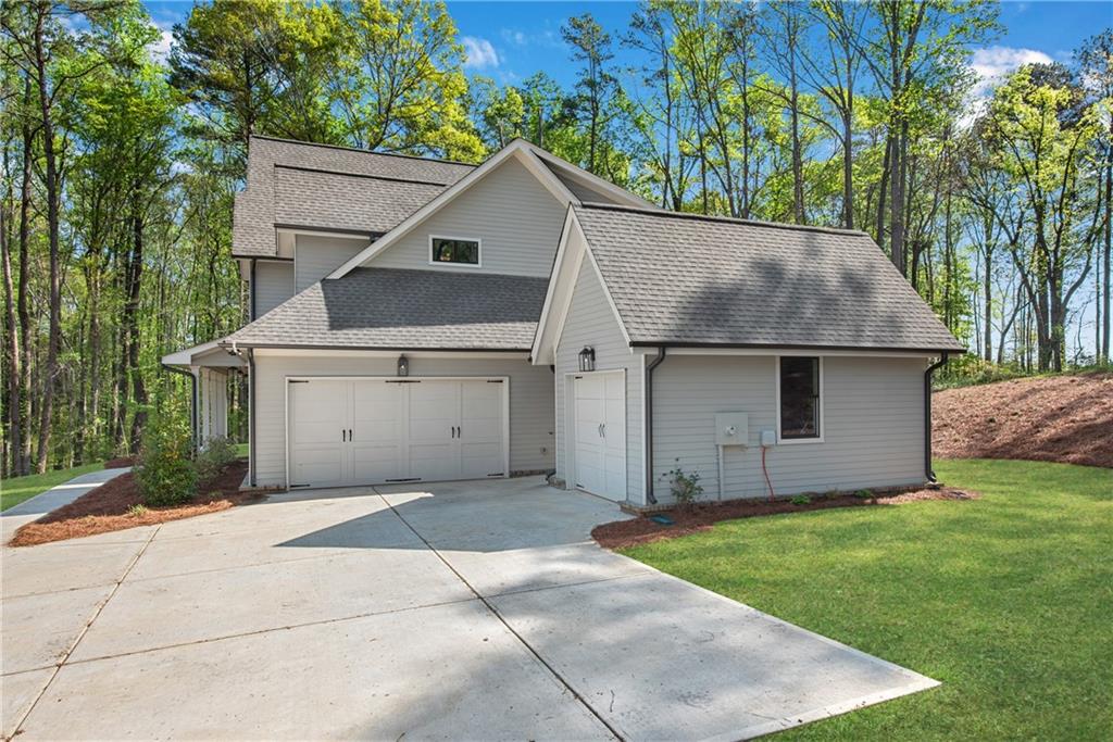 1 Ewing Way Dacula, GA 30019 - Photo 6 of 50 a view of a house with a yard and a garage
