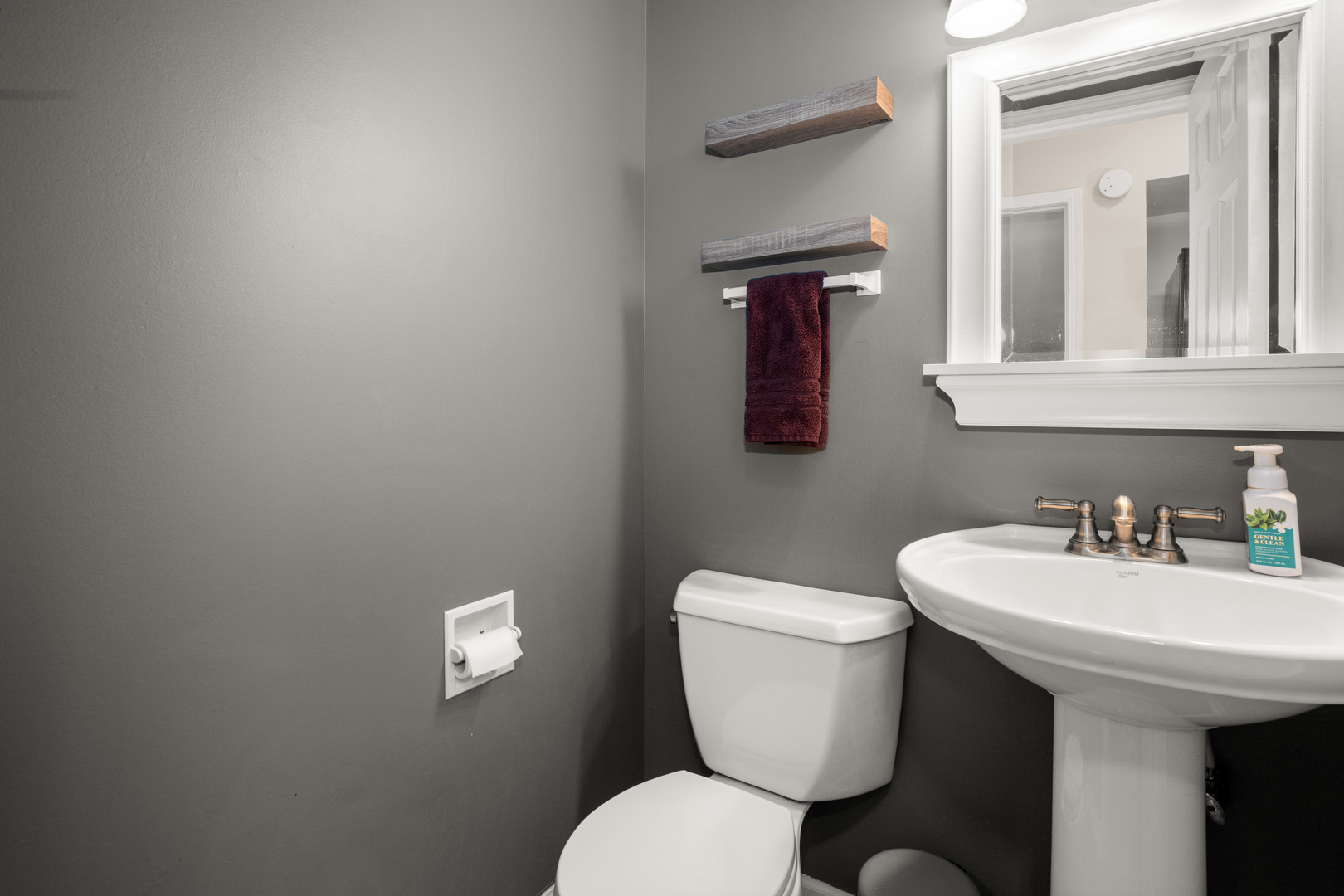 1721 Cedarbrook Court, Unit 1 Sycamore, IL 60178 - Photo 11 of 18 a bathroom with a toilet a sink and mirror