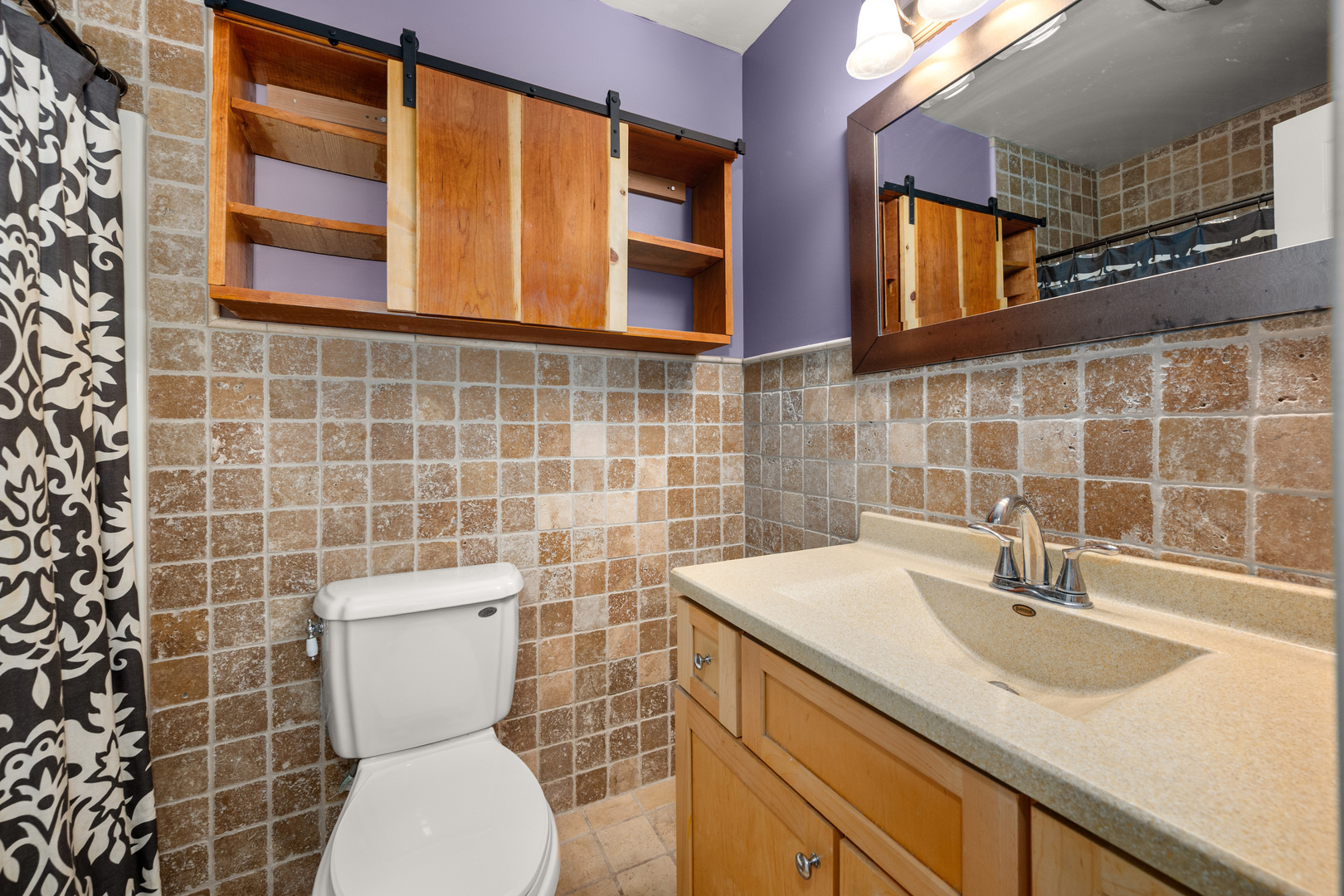 1721 Cedarbrook Court, Unit 1 Sycamore, IL 60178 - Photo 15 of 18 a bathroom with a sink a toilet and a mirror