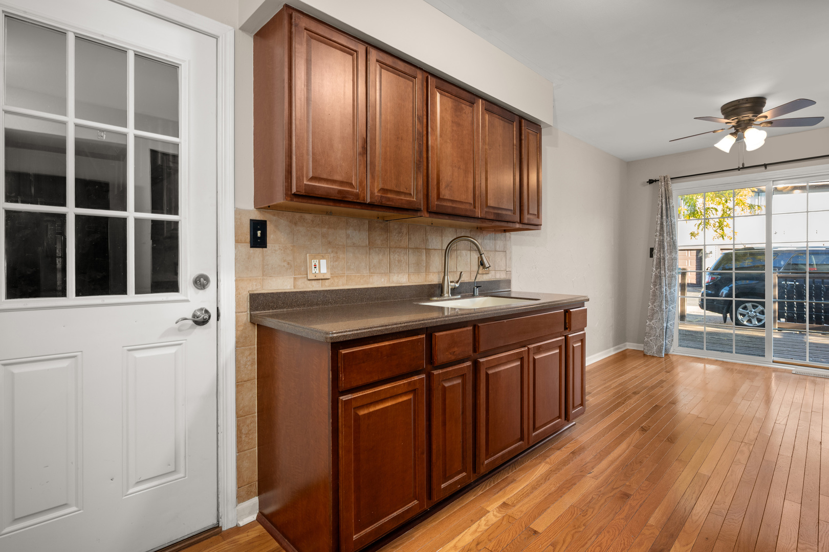 1721 Cedarbrook Court, Unit 1 Sycamore, IL 60178 - Photo 10 of 18 a kitchen with stainless steel appliances granite countertop wooden cabinets a sink and dishwasher with wooden floor