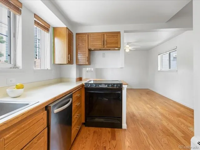 a kitchen with stainless steel appliances granite countertop a stove and a sink