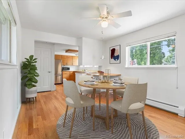 a view of a dining room with furniture window and wooden floor