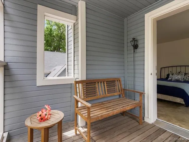 a outdoor living space with furniture and a potted plant