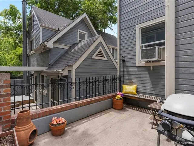 a view of a chair and table in the balcony