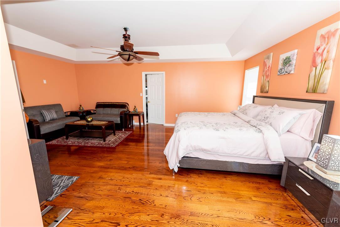 140 Fox Ridge Nazareth, PA 18064 - Photo 18 of 24 a bedroom with a bed chandelier and a window