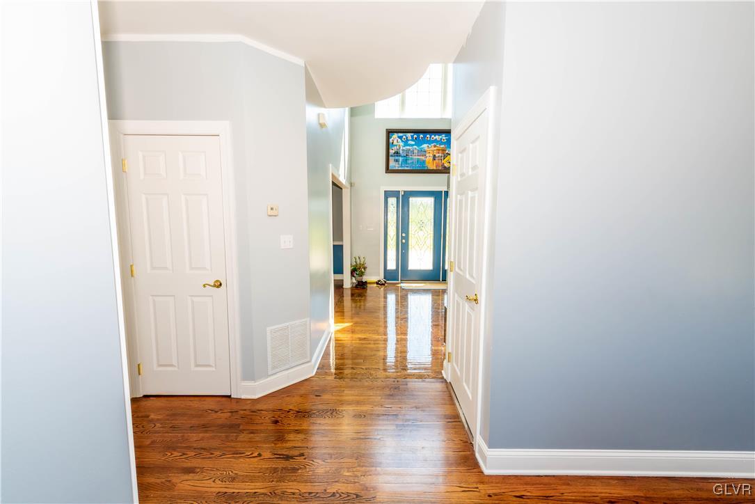 140 Fox Ridge Nazareth, PA 18064 - Photo 2 of 24 a view of a hallway with wooden floor and a cabinet